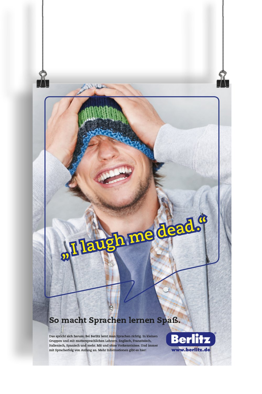 Berlitz Plakat Schriftzug "I laugh me dead" und Mann mit Mütze